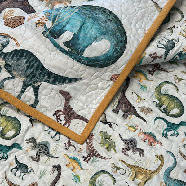 Dawn Of The Dino Baby Quilt