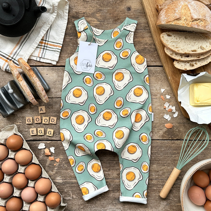 https://www.lovebeebaby.com/cdn/shop/products/lovebee-club-egg-printed-long-rolled-romper_800x.jpg?v=1676292897